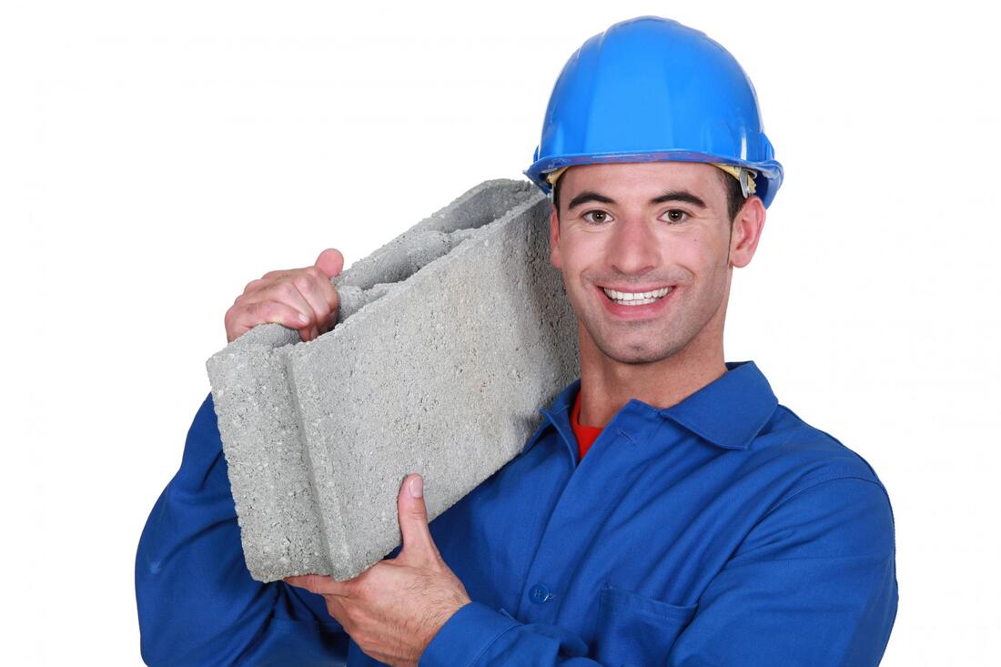 man holding a hollow blocks