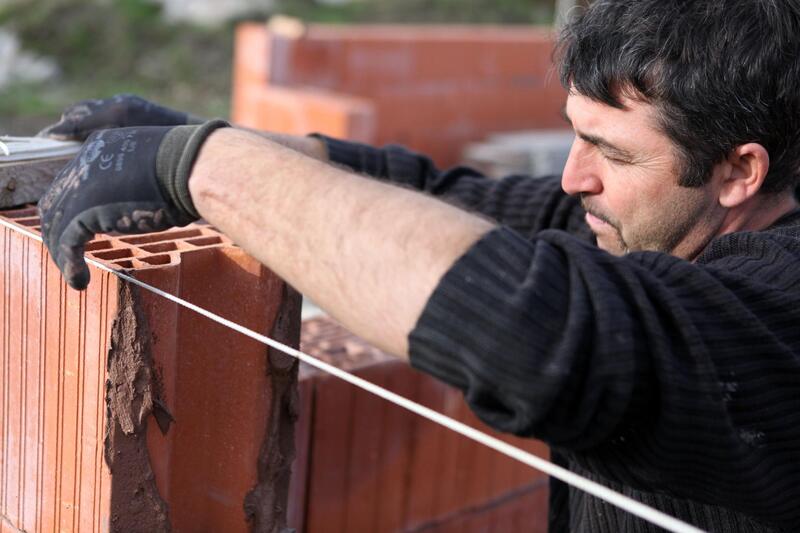 a man installing bricks