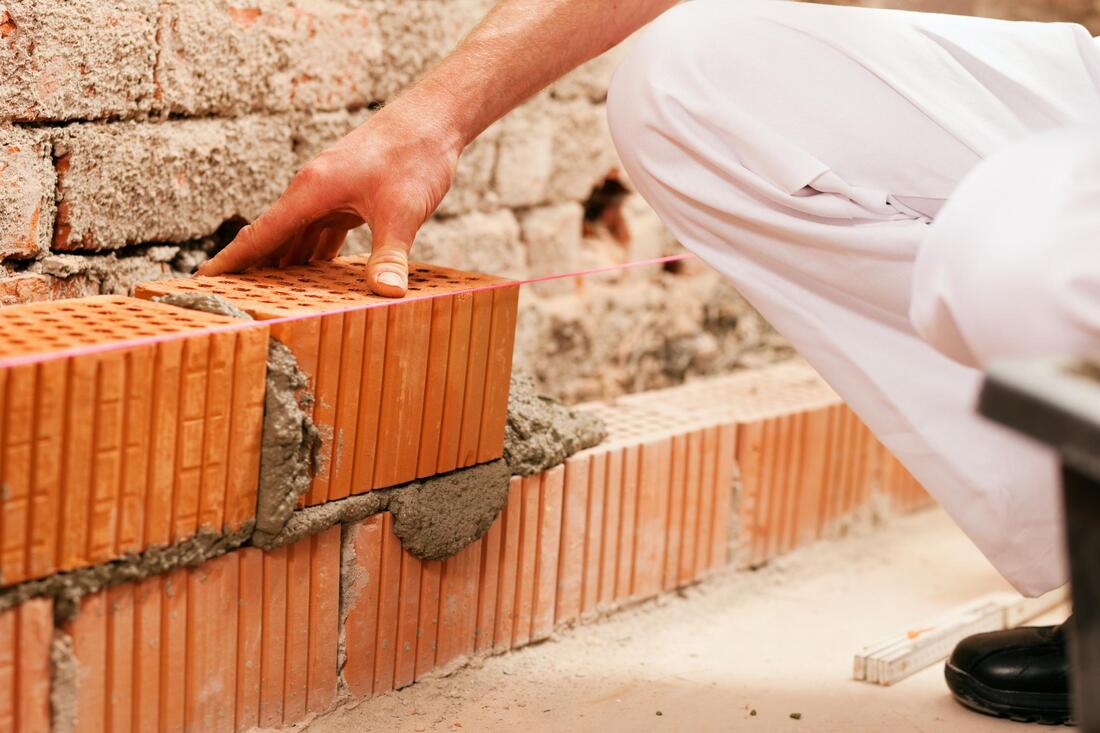 a man installing bricks